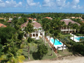 Luxury golf villa with private pool and service staff in exclusive resort near private beach